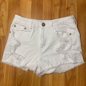 White ripped shorts